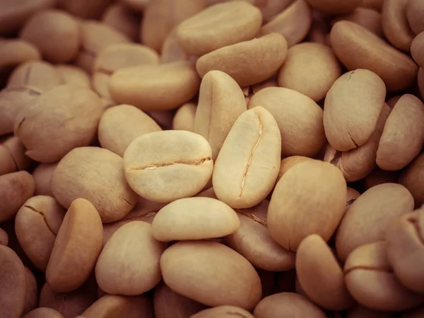 Green coffee beans macro with filter effect retro vintage style — Stock Photo, Image