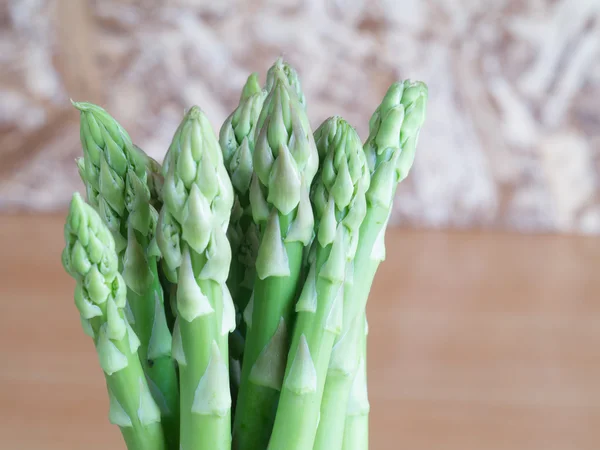 Asparagus on wooden table — Stock Photo, Image