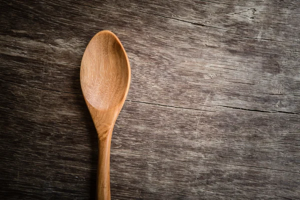 Holzlöffel auf Holztisch mit Filtereffekt im Retro-Vintage-Stil — Stockfoto