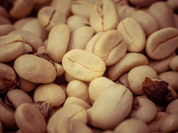 Green coffee beans macro with filter effect retro vintage style — Stock Photo, Image