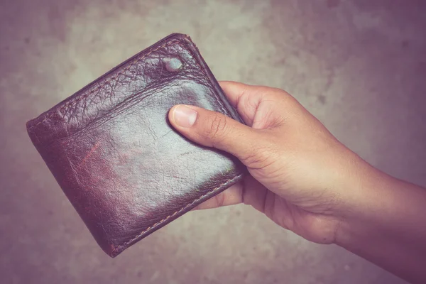 Hand and wallet with filter effect retro vintage style — Stock Photo, Image