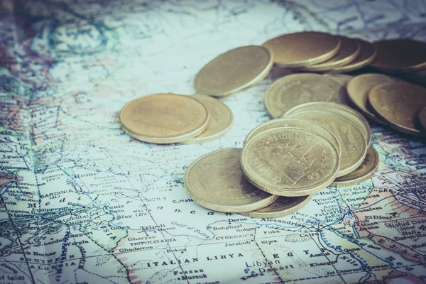 Coin and a map  with filter effect retro vintage style — Stock Photo, Image