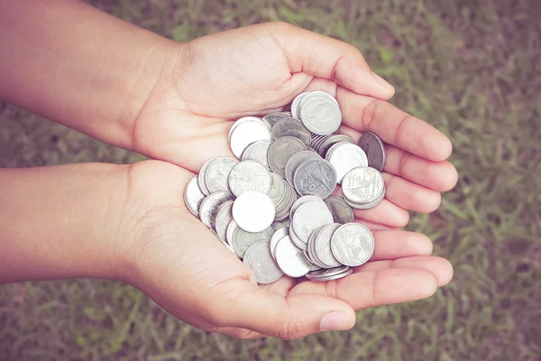 Hands holding money with filter effect retro vintage style — Stock Photo, Image