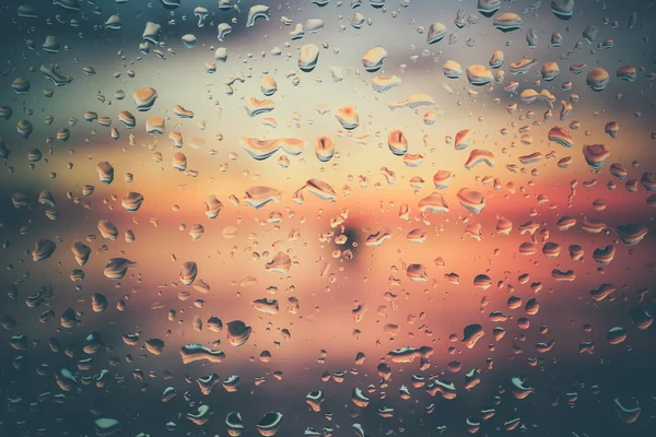 Drops of rain on glass with filter effect retro vintage style — Stock Photo, Image