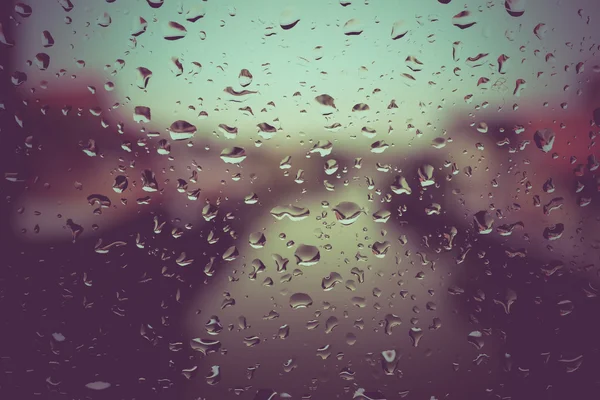 Drops of rain on glass with filter effect retro vintage style — Stock Photo, Image