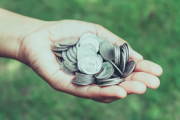 Hands holding money with filter effect retro vintage style — Stock Photo, Image