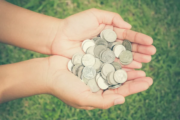 Hands holding money with filter effect retro vintage style — Stock Photo, Image