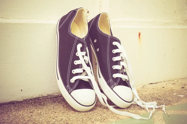 Black sneakers with filter effect retro vintage style — Stock Photo, Image