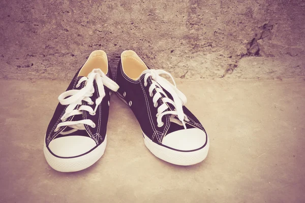 Black sneakers with filter effect retro vintage style — Stock Photo, Image