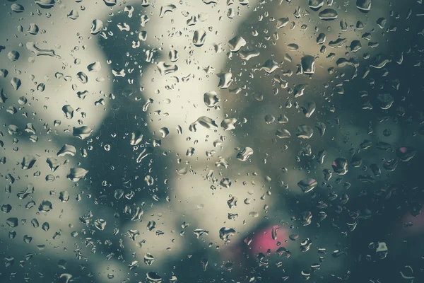 Drops of rain on glass with filter effect retro vintage style — Stock Photo, Image