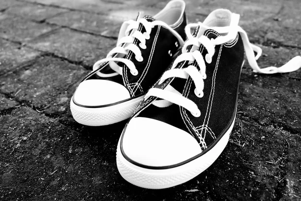 Black sneakers with filter effect retro vintage style — Stock Photo, Image