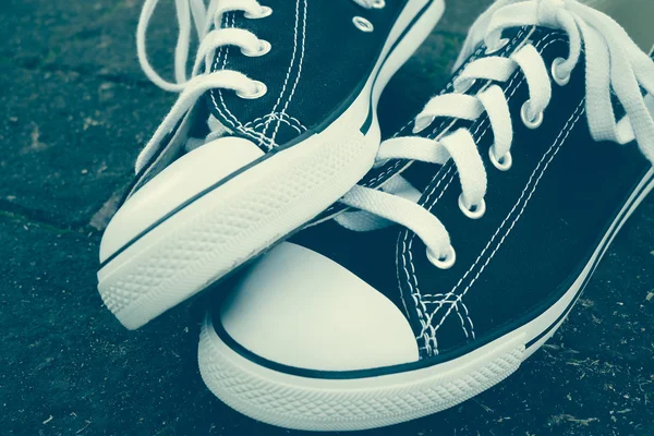 Black sneakers with filter effect retro vintage style — Stock Photo, Image