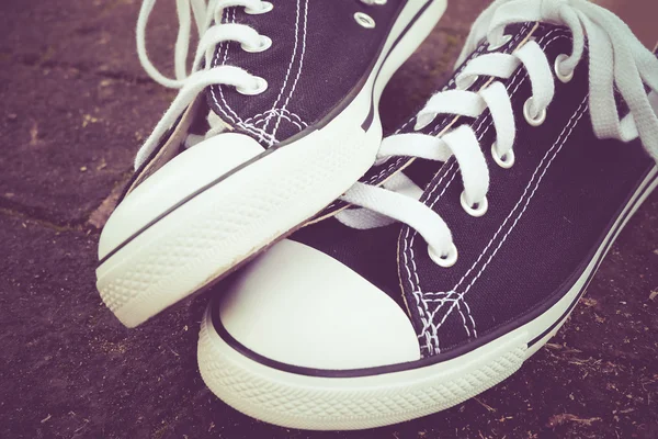 Black sneakers with filter effect retro vintage style — Stock Photo, Image