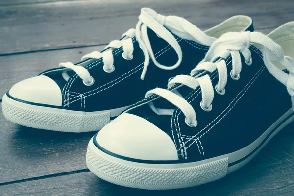 Black sneakers with filter effect retro vintage style — Stock Photo, Image