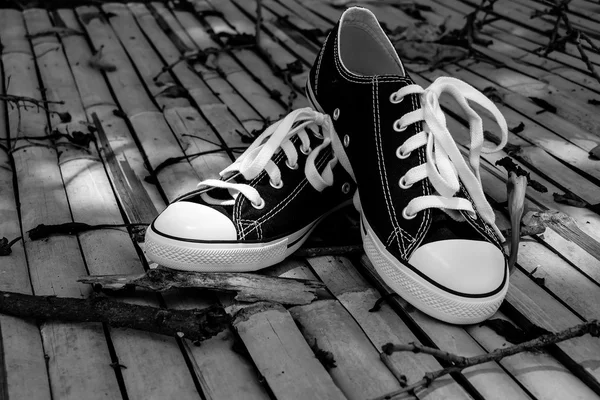 Black sneakers with filter effect retro vintage style — Stock Photo, Image