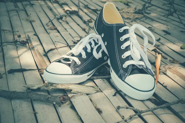 Black sneakers with filter effect retro vintage style — Stock Photo, Image