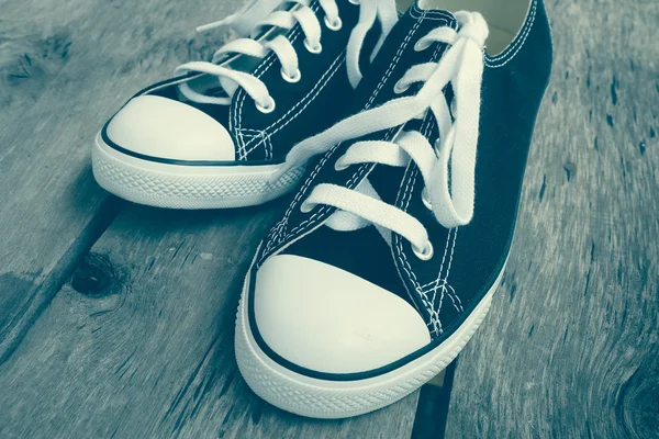 Black sneakers with filter effect retro vintage style — Stock Photo, Image