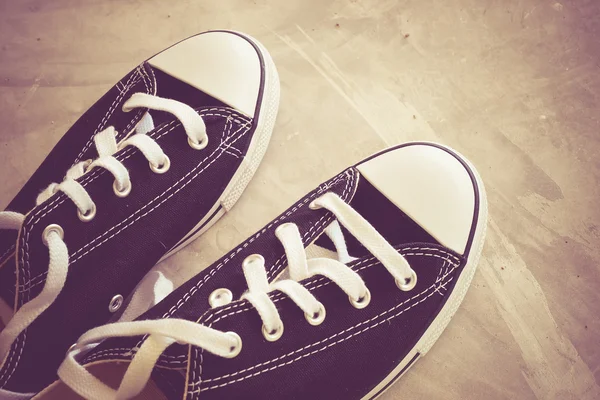 Black sneakers with filter effect retro vintage style — Stock Photo, Image