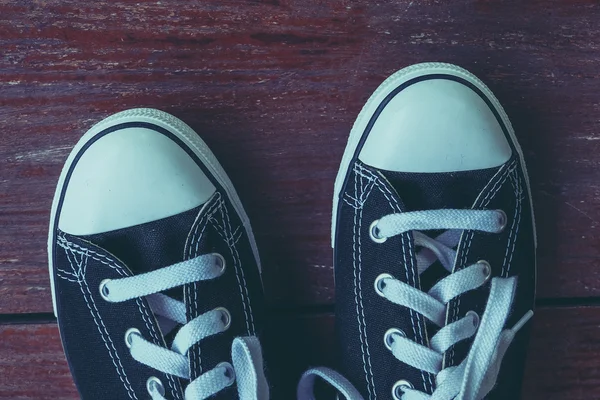 Black sneakers with filter effect retro vintage style — Stock Photo, Image