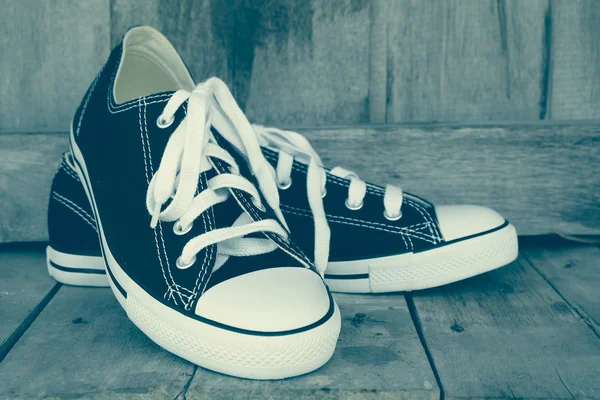 Black sneakers with filter effect retro vintage style — Stock Photo, Image