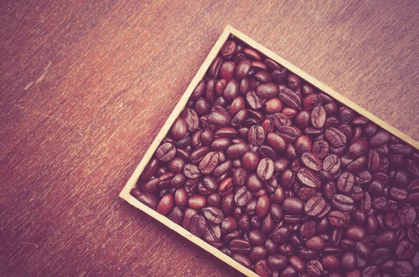 Grãos de café com efeito de filtro estilo vintage retro — Fotografia de Stock