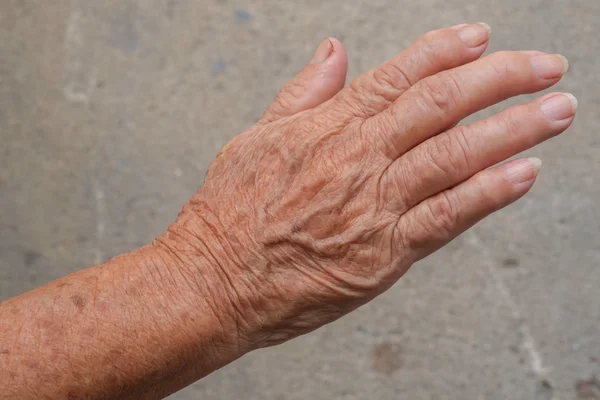 Senior woman's hand — Stock Photo, Image