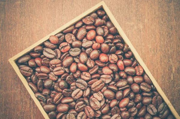 Granos de café con efecto de filtro retro estilo vintage — Foto de Stock