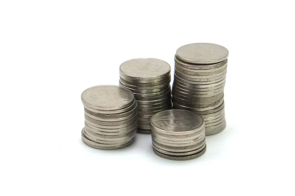 Pila de monedas sobre fondo blanco —  Fotos de Stock