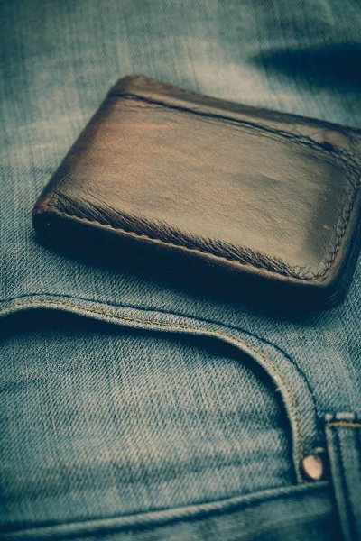 Carteira e jean com efeito de filtro estilo vintage retro — Fotografia de Stock