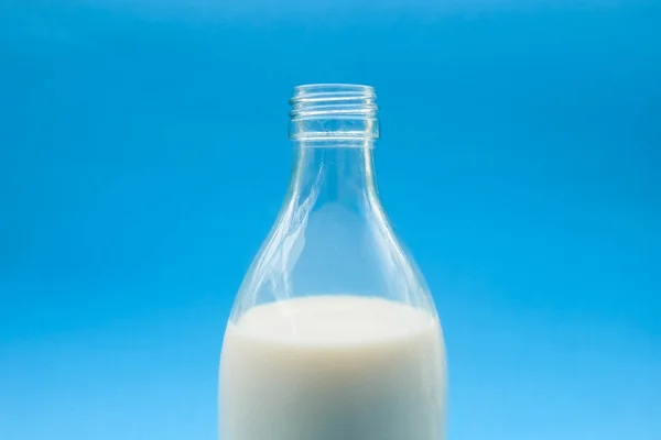 With milk on blue background — Stock Photo, Image