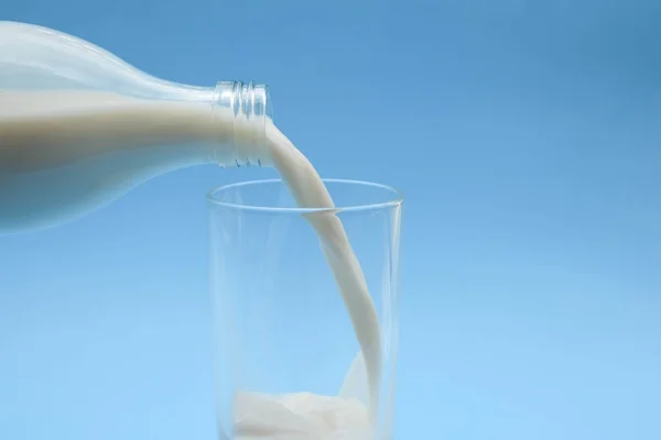 With milk on blue background — Stock Photo, Image