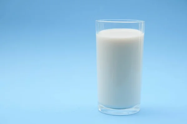 With milk on blue background — Stock Photo, Image