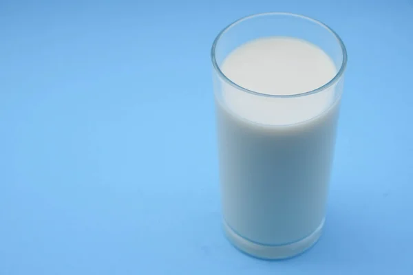 With milk on blue background — Stock Photo, Image