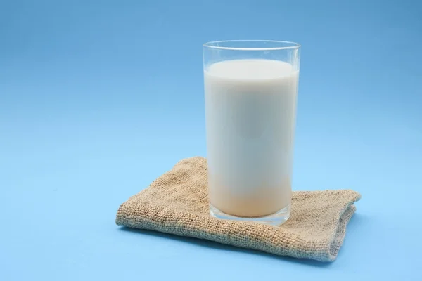 With milk on blue background — Stock Photo, Image