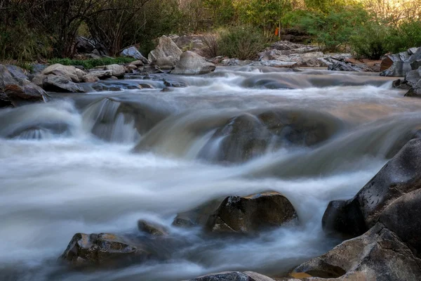 Creek flowing over the rocks — Stock Photo, Image