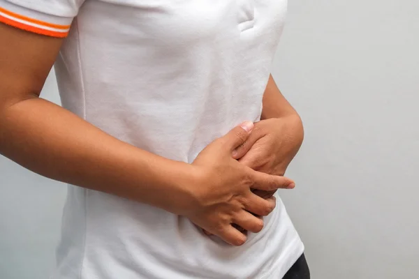 Close-up Of Woman Suffering From Stomach Ache — Stok Foto