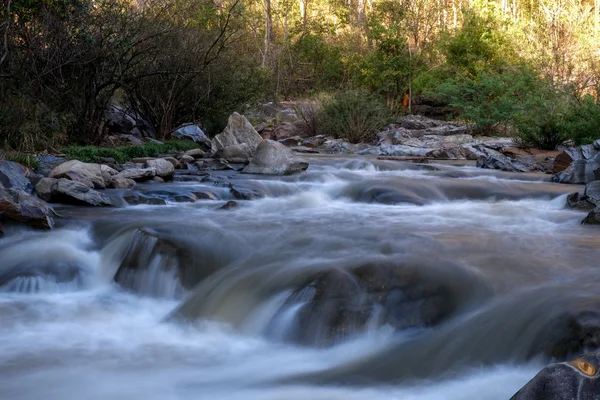 Creek flowing over the rocks — Stock Photo, Image