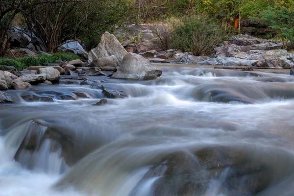 Creek flowing over the rocks — Stock Photo, Image