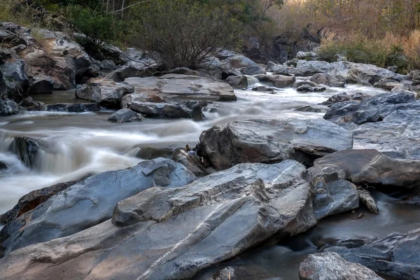 Creek flowing over the rocks — Stock Photo, Image