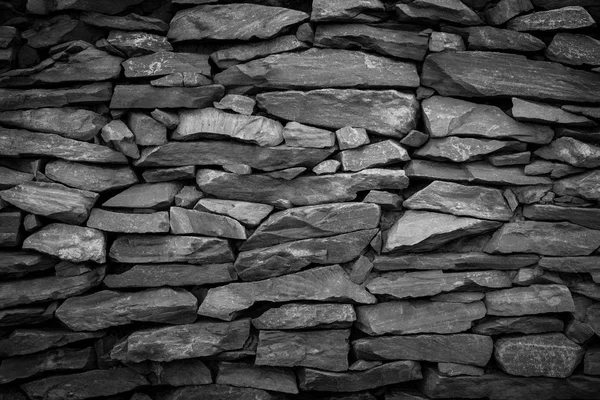 Fondo de piedra de pared negro — Foto de Stock