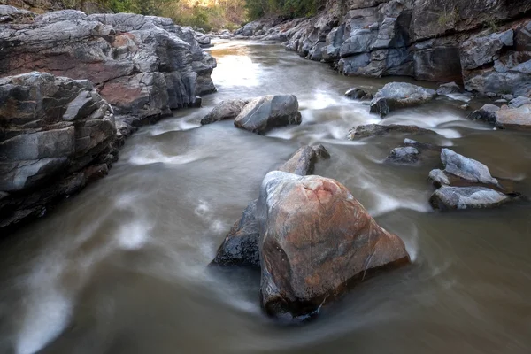 Creek flowing over the rocks — Stock Photo, Image