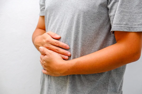 Hombre que sufre de dolor de estómago Ache —  Fotos de Stock