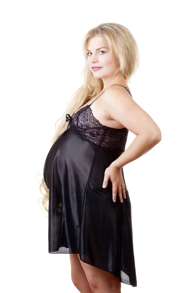 Mladá těhotná žena má dlouhé blond vlasy — Stock fotografie