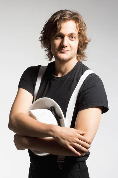 Young Man with Brown Hair Holding a White Hat — Stock Photo, Image