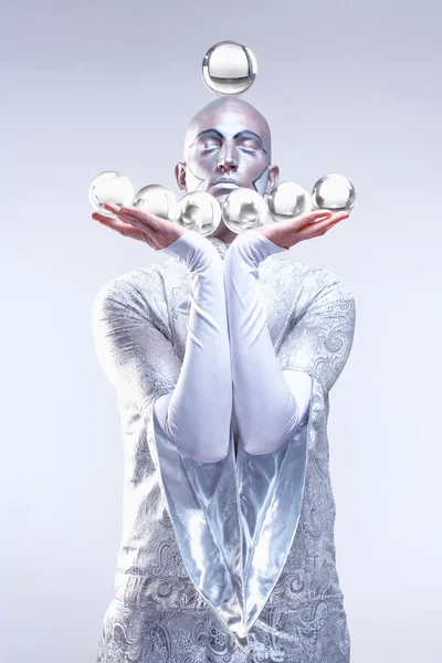 Magician with Glass Balls in Stage Makeup and Costume — Stock Photo, Image