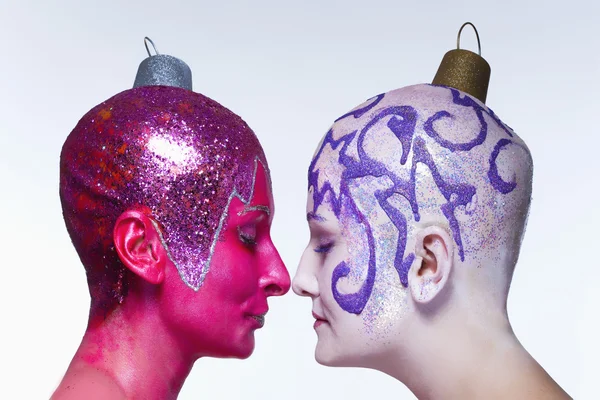 Two women posing as Christmas ornaments — Stock Photo, Image