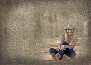 Cowgirl oturan ile dokulu arka plan