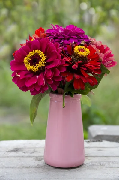 Red flowers in a vase — Stock Photo, Image