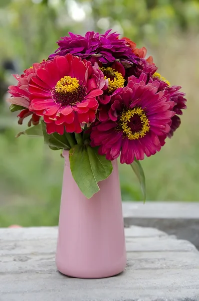 Red flowers in a vase — Stock Photo, Image