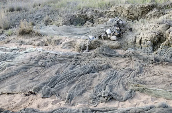 Fiske net ligga på stranden — Stockfoto